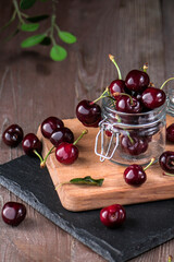 Fresh cherry in bowl on wooden table