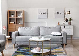 Interior of modern room with table and sofa