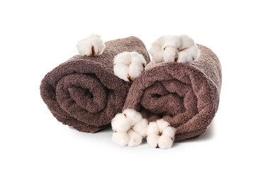 Obraz na płótnie Canvas Cotton flowers and soft towels on white background