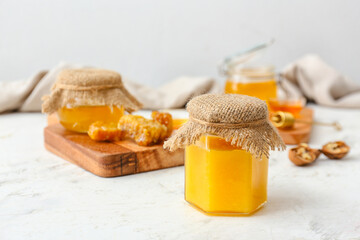 Obraz na płótnie Canvas Jar of sweet honey on table