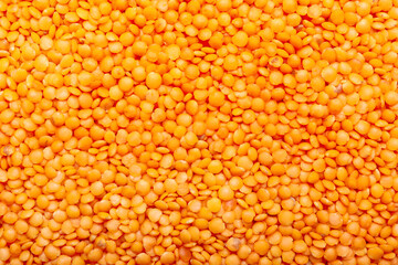 Red lentils as background, closeup