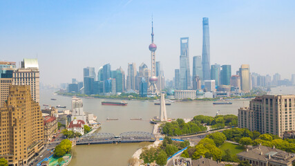 Fototapeta premium Aerial shot of Lujiazui, the financial district in Shanghai, China, in a sunny day.
