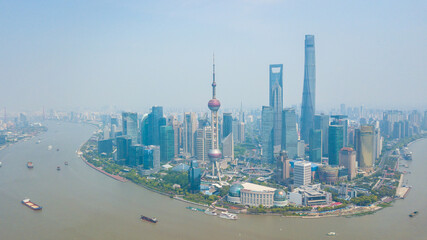 Naklejka premium Aerial shot of Lujiazui, the financial district in Shanghai, China, in a sunny day.