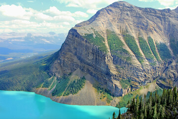 The view on the turquoise Lake Louise and the wrinkled rocky mountain from Big Beehive trail view...