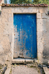 Blue door to cottage in rural French village
