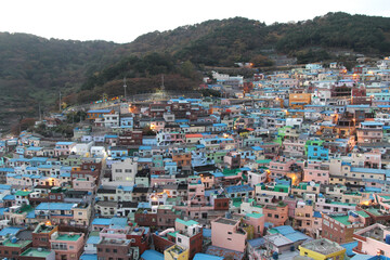 Gamcheon Culture Village which is houses built in staircase-fashion on the foothills of a coastal mountain during sunset in autumn, Busan, South Korea