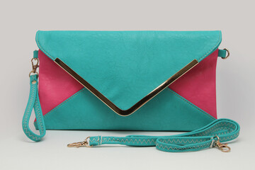 Small turquoise-pink female handbag