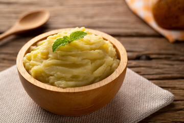 Homemade Mashed potatoes in wooden bowl,made from boiled potatoes mixed with butter and milk.
