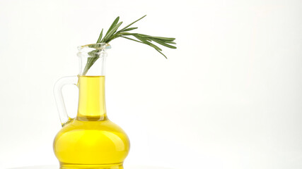 olive oil in bottle with sprig of rosemary, white background