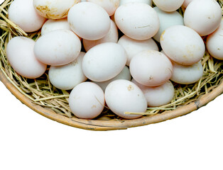 Fresh eggs in a rice straw basket isolated on white background
