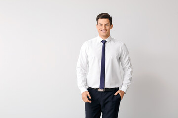 Portrait of businessman on light background