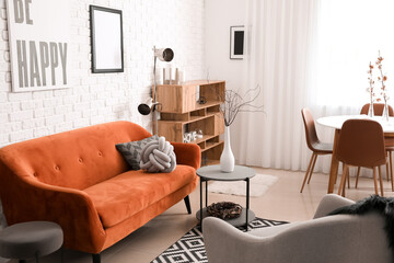 Stylish interior of living room with comfortable sofa