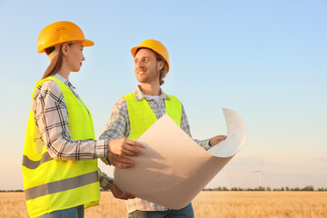 Engineers on windmill farm for electric power production