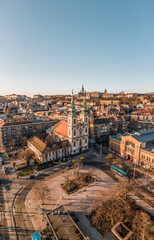 Fototapeta premium Aerial drone shot of facade of St. Anne Parish church during Budapest sunrise