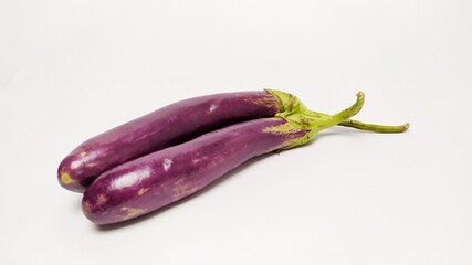 Close up fresh purple eggplant or terong isolated on white background