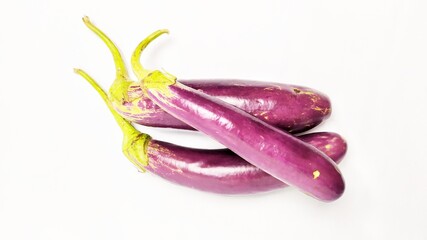 Close up fresh purple eggplant or terong isolated on white background