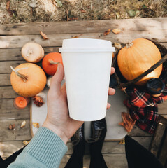 Cup of coffee on a background of pumpkins. Halloween holiday. Thanksgiving concept.