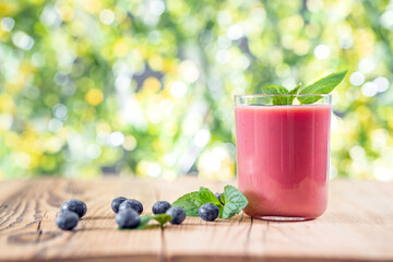 Red smoothie dessert in glasses. Healthy appetizing