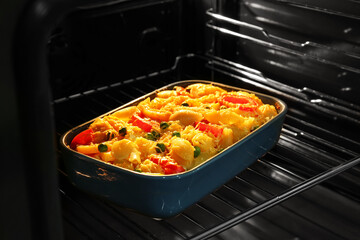 Baking of tasty pasta in oven