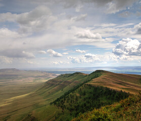 View of the hills. Mountain-steppe landscape with clouds. South Siberia. The Republic of Khakassia.