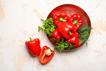 Plate with red bell pepper on table