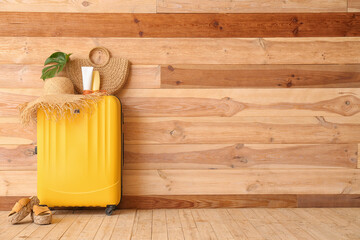 Packed luggage near wooden wall. Travel concept