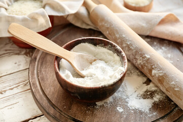 Bowl with flour on table