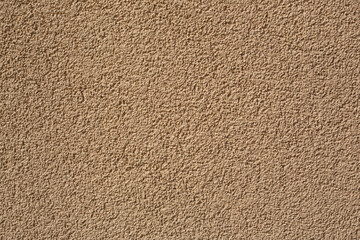 The texture of the brown wall. Decorative plaster.  Rough grainy bumpy surface. Perfect for...