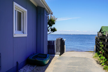 l'herbe cap ferret oyster village in Arcachon Bay with wooden hut and access to sea beach