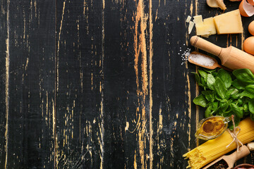 Ingredients for tasty pasta carbonara on dark wooden background