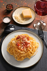Plate with tasty pasta carbonara on table