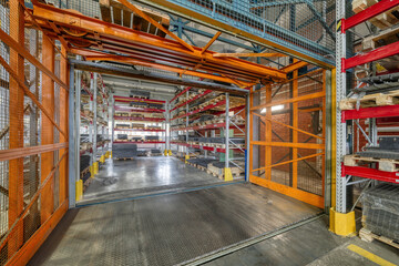 Factory warehouse steel reinforcement. High stacked shelving.