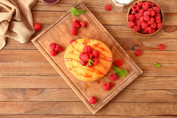 Sweet pancakes with berries on table