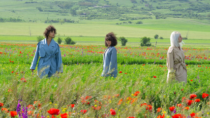 Young women in the poppies field