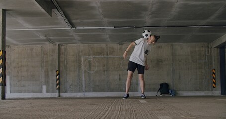 Teenager girl football soccer player practicing