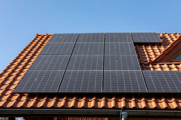 Solar electric panels on a house roof in  Ochojno. Poland