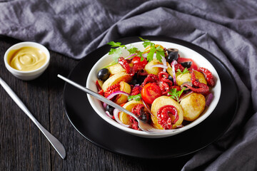 Italian side dish baby octopuses with vegetables
