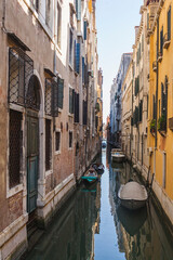 Fototapeta na wymiar Boats in one of the canals of Venice
