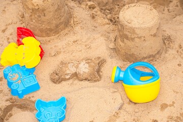 On the beach are children's toys that are played in the sand