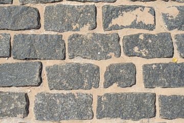 Texture of grey bricks with sand