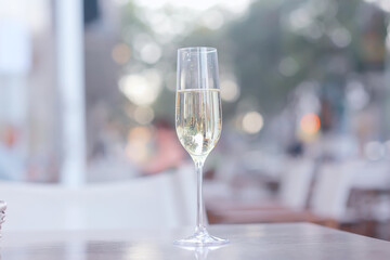 glass white wine restaurant interior, abstract evening dinner with alcohol at the bar