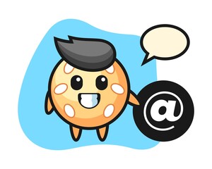 Sesame ball cartoon standing beside the At symbol