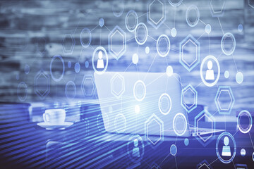 Computer on desktop with social network hologram. Double exposure. Concept of international people connections.