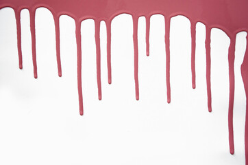 Pink thick paint spreads on a white background, stains paint brush texture