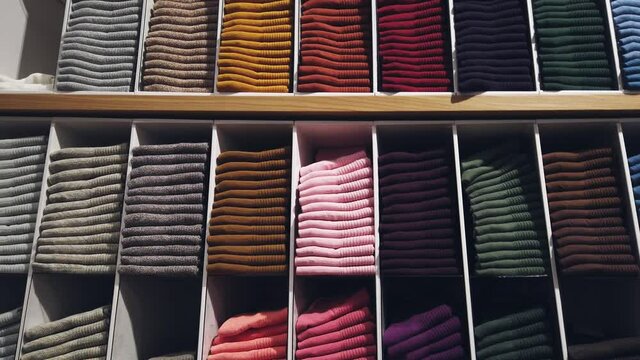 there are many different colors of socks on the market counter