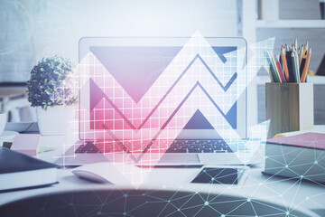 Computer on desktop with point up arrows hologram. Double exposure. Concept of success.