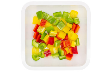 Sliced bell pepper in single white ceramic bowl.