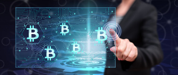Woman touching a bitcoin concept
