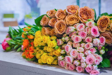 Colorful beautiful flowers bouquet - roses at studio, flower shop - close up view. Floristry, romantic, holiday, birthday, valentine day, wedding, celebration concept