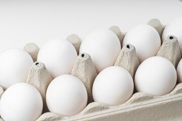 six white chicken eggs, top view